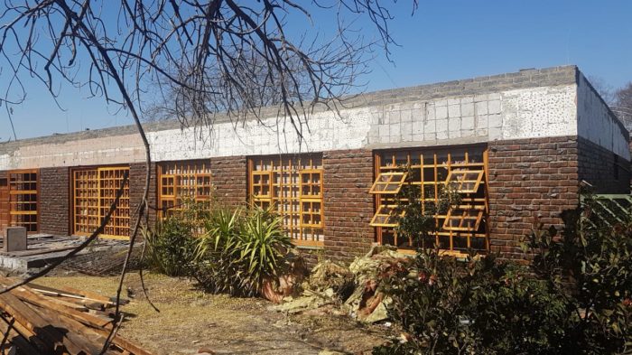 Convert flat roof into pitched roof