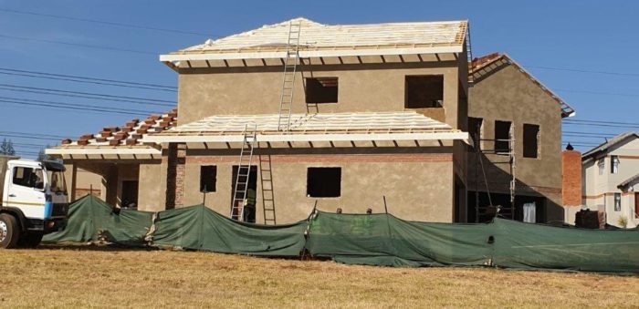 Installation of new roof and laying of tiles