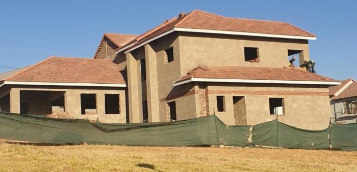 Prefabricated timber roof trusses covered with Marley Modern